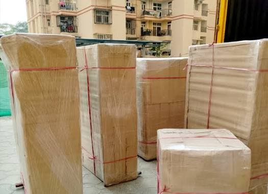 Mover carefully packing glass vase